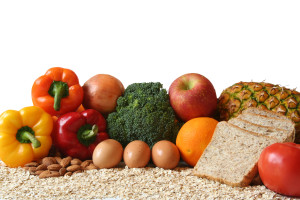 variety of fresh healthy foods fruits vegetables whole grains and dairy.